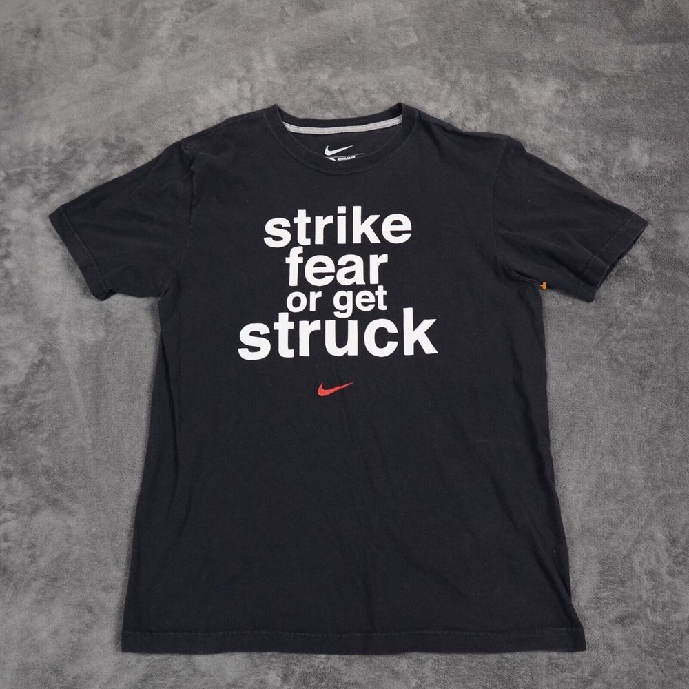 Nike Shirt Mens Medium Black STRIKE FEAR OR GET STRUCK Center Red Swoosh Fading